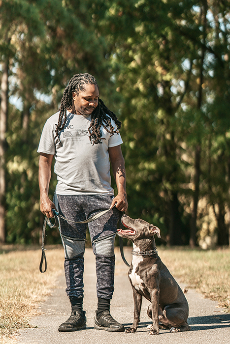 first watch canine academy owner mike hill with a graduate of his dog training program in durham